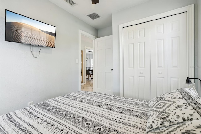 bedroom featuring ceiling fan and a closet