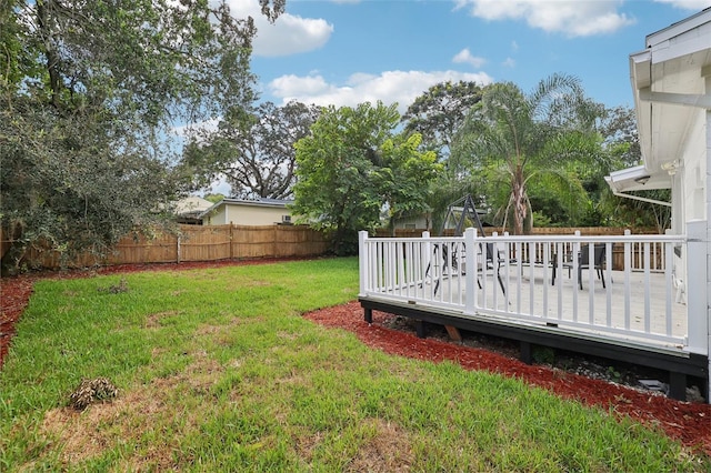 view of yard with a wooden deck