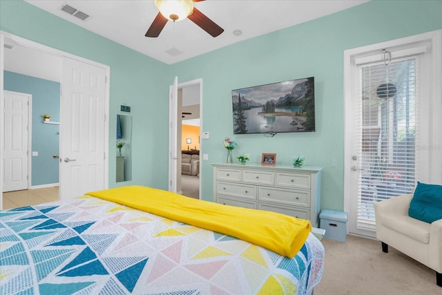 bedroom with light carpet and ceiling fan