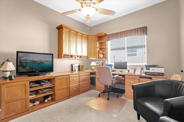 carpeted office with ceiling fan