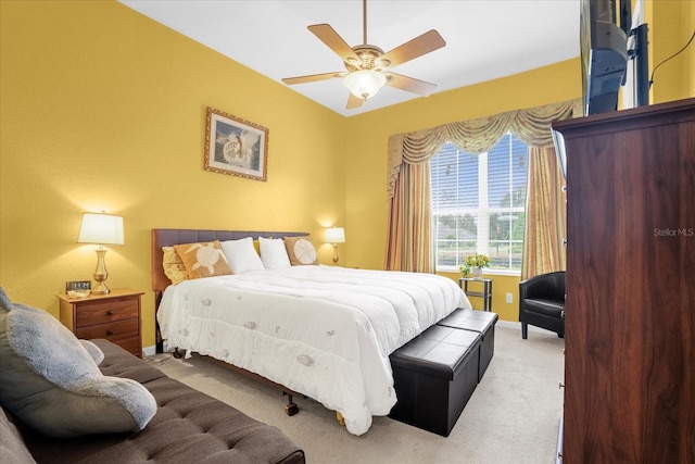 bedroom featuring light colored carpet and ceiling fan