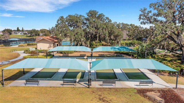 view of pool featuring a lawn