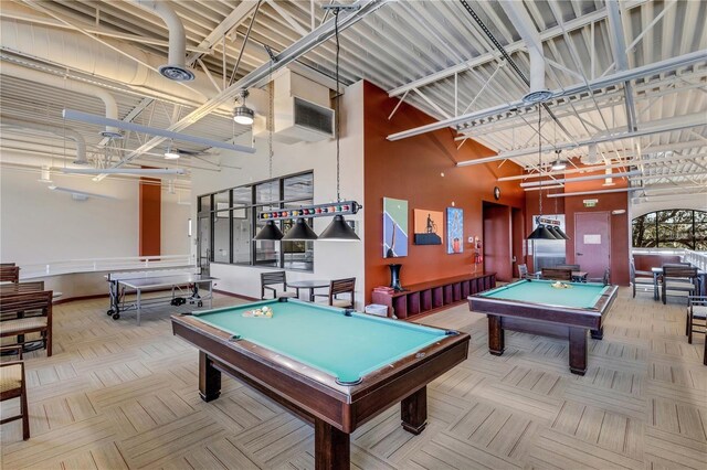 recreation room with carpet floors, a high ceiling, baseboards, and pool table