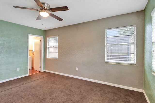 spare room with carpet and ceiling fan