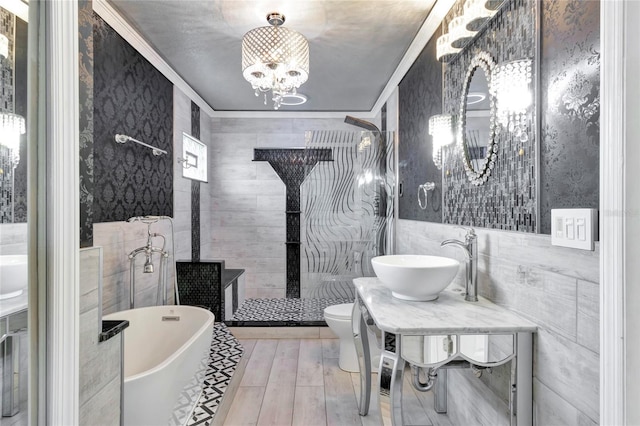 full bathroom featuring tile walls, independent shower and bath, hardwood / wood-style flooring, toilet, and sink