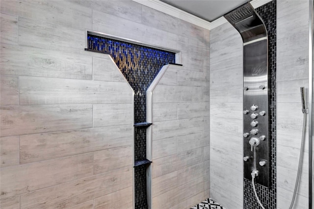 interior details with a tile shower and ornamental molding