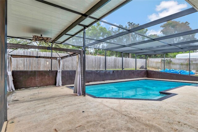 view of pool with a lanai and a patio area