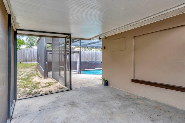 view of patio featuring a lanai and a fenced in pool