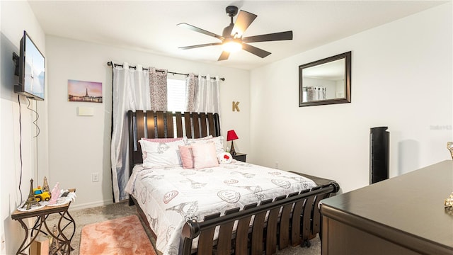 bedroom with dark carpet and ceiling fan