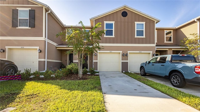 view of front of house with a garage and a front yard