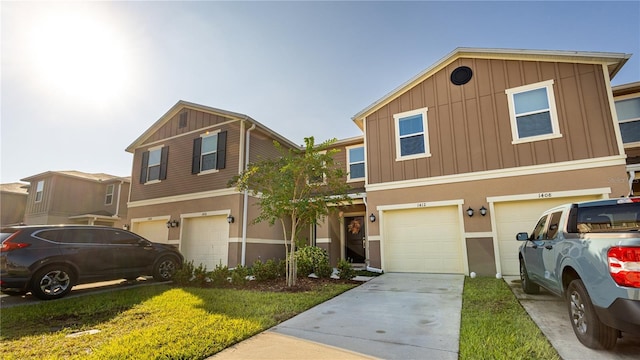 view of front facade with a garage and a front lawn