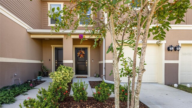 doorway to property featuring a garage