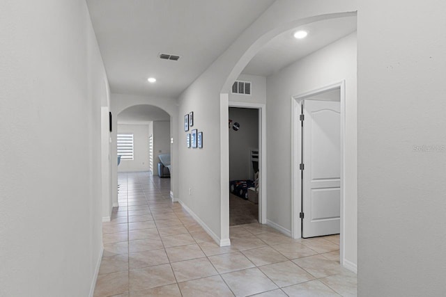 corridor featuring light tile patterned flooring