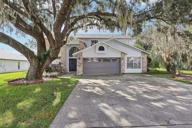 view of front of home with a garage and a front yard