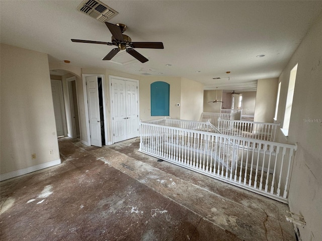 interior space featuring ceiling fan