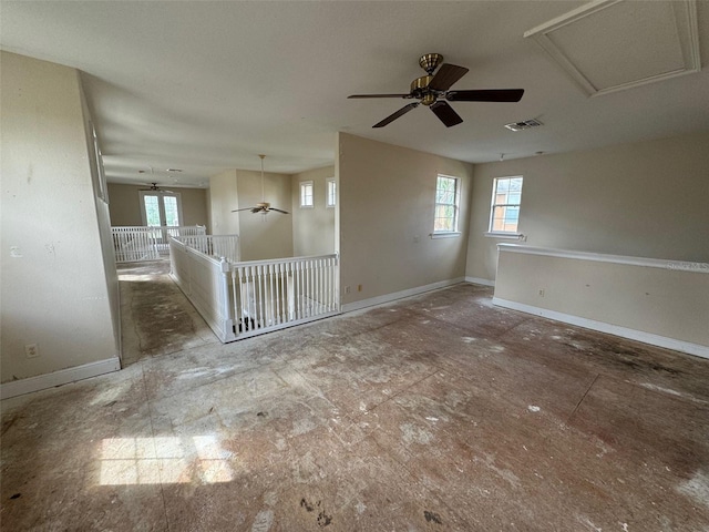 spare room with ceiling fan and a healthy amount of sunlight