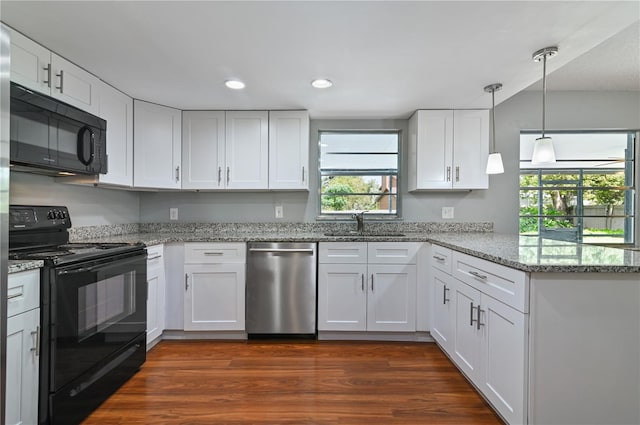 kitchen featuring white cabinets, a peninsula, and black appliances