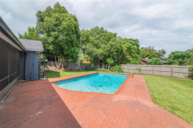 view of swimming pool featuring a fenced in pool, a fenced backyard, a yard, and a patio