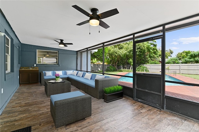 sunroom / solarium with ceiling fan and a wealth of natural light