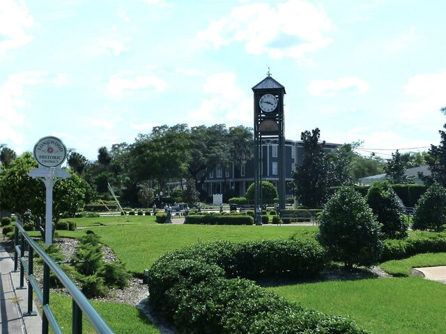 view of home's community with a yard