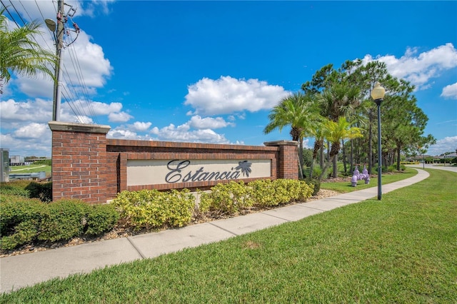 1033 Hacienda Cir, Kissimmee, FL 34741 - community / neighborhood sign featuring a lawn