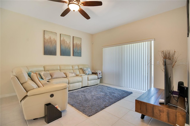 tiled living room featuring ceiling fan