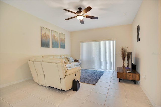 living room featuring ceiling fan and light tile patterned flooring