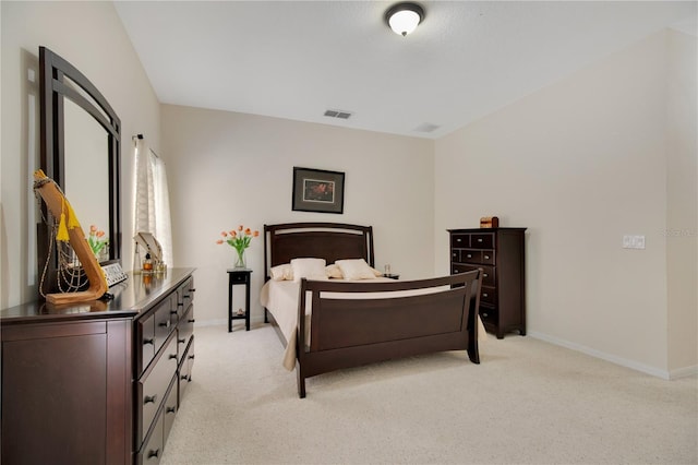 bedroom featuring light carpet