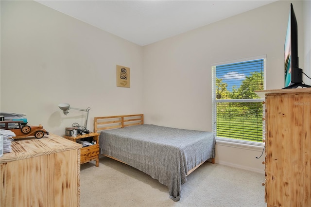 bedroom with light colored carpet