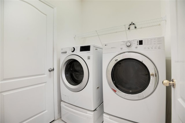 laundry room with washer and dryer