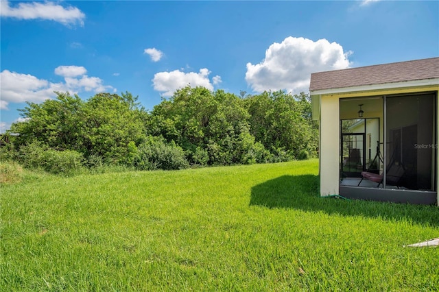 view of yard featuring a sunroom