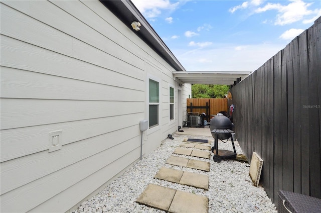 view of side of property with a patio