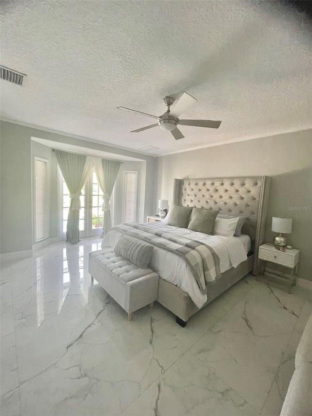 bedroom with french doors, ceiling fan, and a textured ceiling