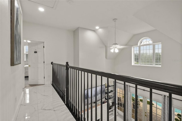 corridor featuring vaulted ceiling