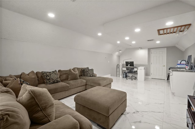 living room featuring a textured ceiling and lofted ceiling