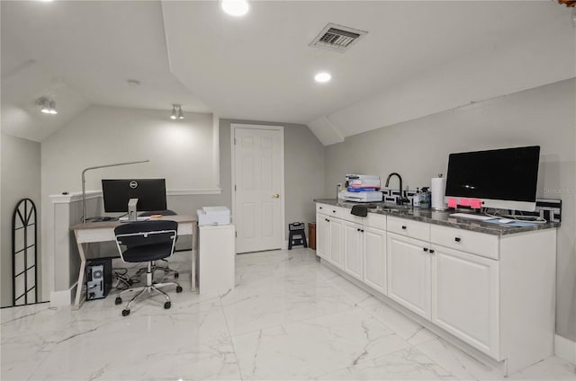 home office featuring lofted ceiling