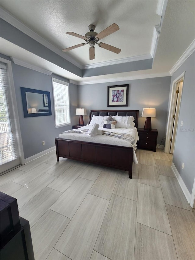 bedroom featuring ceiling fan, ornamental molding, a textured ceiling, and multiple windows