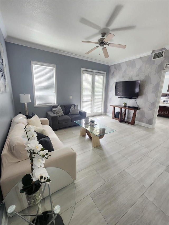 living room featuring ceiling fan and ornamental molding