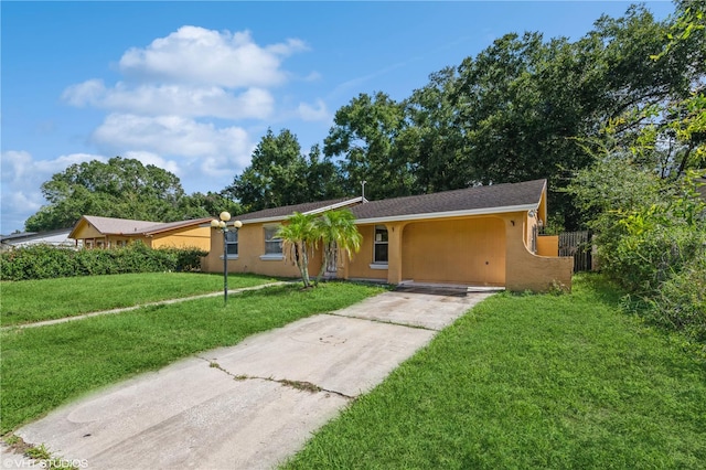 single story home featuring a front yard