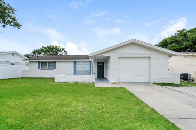 single story home featuring a garage, a front lawn, and central AC