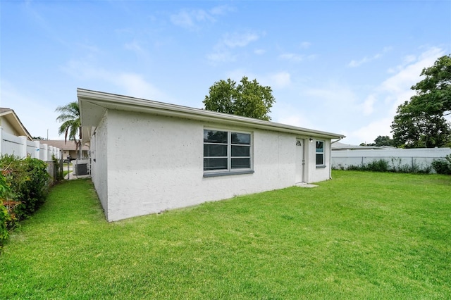 back of house featuring a yard