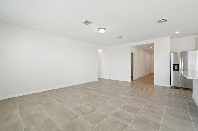 spare room with recessed lighting, visible vents, baseboards, and light tile patterned floors