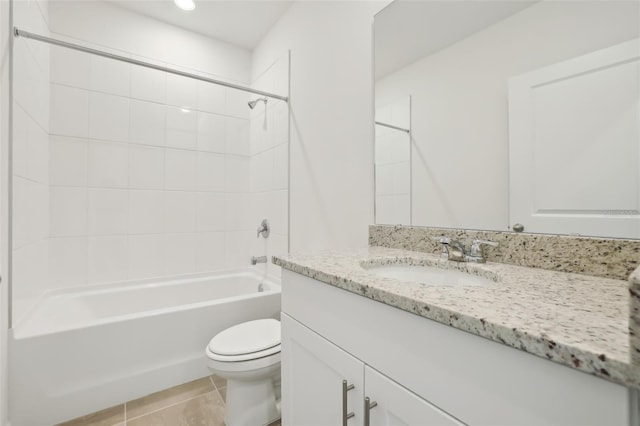 bathroom featuring vanity, bathing tub / shower combination, toilet, and tile patterned floors