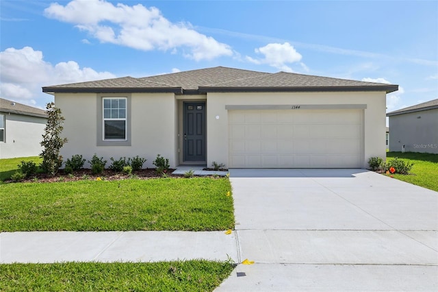 view of front of house with stucco siding, a front lawn, concrete driveway, and an attached garage