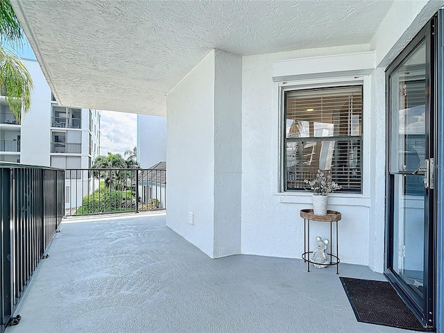 view of patio featuring a balcony