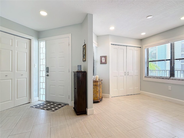 entrance foyer with a textured ceiling