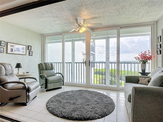 sunroom / solarium featuring ceiling fan