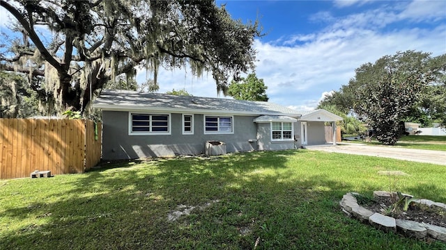 ranch-style home with a front lawn