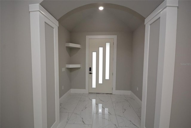 entrance foyer with vaulted ceiling