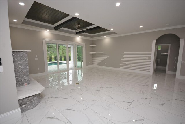 unfurnished living room with a raised ceiling, ornamental molding, and beam ceiling